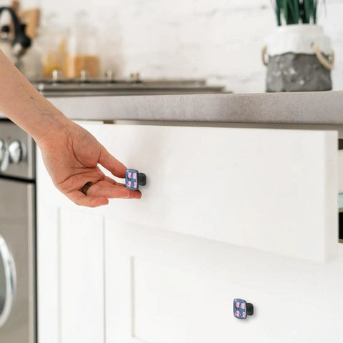 Hand opening white drawer with 4 Pack Crystal Glass Cabinet Knobs With Screws Dope Pink Axolotl Design Drawer Pulls visible