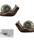 Two Piece Ceramic Snail Toilet Bolt Covers Kicking Up Your Bathroom Vibe With A Super Smooth Push On Install Universal Fit For Worn Floor Bolts And Rusty Plumbing Trim, showing green ceramic snails for decorative use.