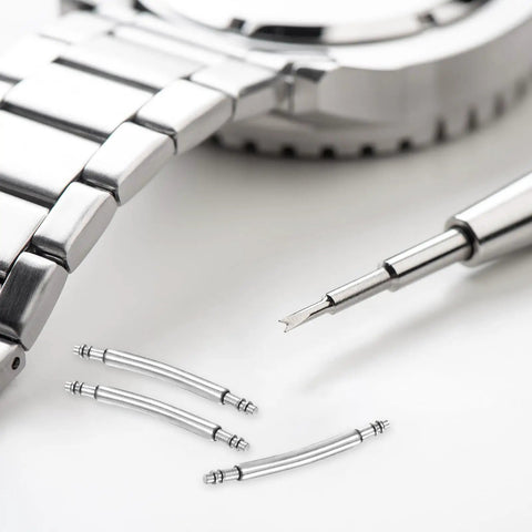 Ten Piece Curved Spring Bar Watch Band Pins Fits 30mm Straps With 1.5mm Diameter crafted from stainless steel with a tool and watch bracelet.