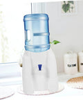 Tabletop Water Dispenser Cooler For Home Office And Outdoor Use on kitchen counter with blue water bottle and white base