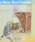 Total Game Changer For Pet Parents Seeking Spill Proof Auto Bird Feeder Cage Dish Made From Heavy Duty Clear Acrylic That Lets Cockatiels Parakeets Canaries And Conures Eat Fresh Seeds Anytime in a birdcage with two parakeets.