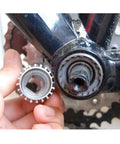 Person using Beefed-Up 20 Tooth Bicycle Bottom Bracket Removal Tool for Cartridge BBs on bike's bottom bracket