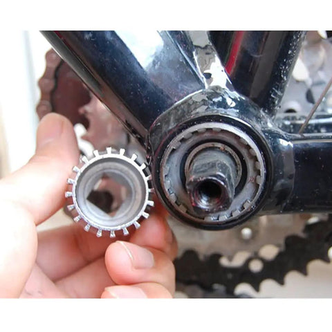 Person using Beefed-Up 20 Tooth Bicycle Bottom Bracket Removal Tool for Cartridge BBs on bike's bottom bracket
