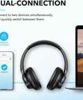 Q20i Hybrid Active Noise Cancelling Wireless Over Ear Headphones With 40 Hour Battery Life Dope Bass Rich Hi Res Audio in black showing dual connection with phone and laptop.