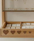Heavy Duty Acrylic Heart Router Template For Practical Woodworking And Charcuterie Boards Features Twelve Cut Sizes Providing Flawless Trimming Lines That Make Custom Inlay Work No Sweat And Straight Fire jewelry display with heart-shaped cutouts and organized compartments