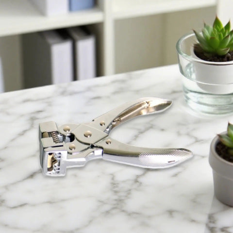 Hisxrcal T Shape Hole Punch Handheld Slot Cutter Tool For Card Name Tags Scrapbooking Projects on a marble table.