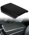 Sleek Carbon Fiber Center Console Cover Compatible With Tesla Model 3 And Model Y 2017 To 2023 on armrest in car interior.