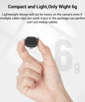 Hand holding lightweight Camera Cable Lock Clamp 4 Pack For HDMI SDI And Microphone Cables Keeps DSLR Rig Cages And Handles