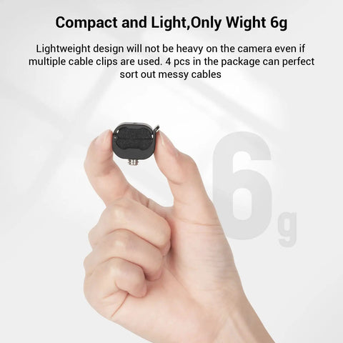 Hand holding lightweight Camera Cable Lock Clamp 4 Pack For HDMI SDI And Microphone Cables Keeps DSLR Rig Cages And Handles