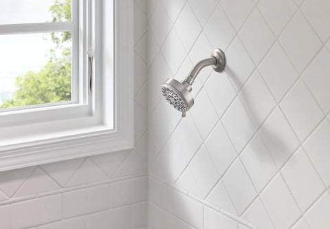 Five Function Shower Head With Three And Three Quarters Inch Spray Face Wall Mount In Spot Resist Brushed Nickel Finish on white tiles