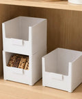 Versatile Big Capacity Heavy Duty Stackable Storage Bins Open Top Space Saving Closet Organizer with snacks in a kitchen.