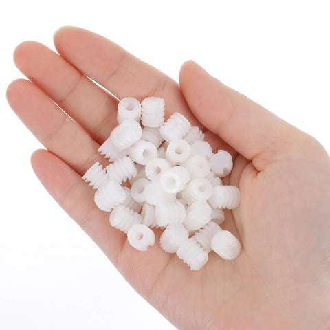 Hand holding 100 Pack Nylon Cabinet Hinge Dowels 0.34 By 0.39 Inches Plastic Furniture Dowel Pins For A Quick Fix And Easy Install Durable Nylon Construction For Long Lasting Cabinet And Furniture Hinges