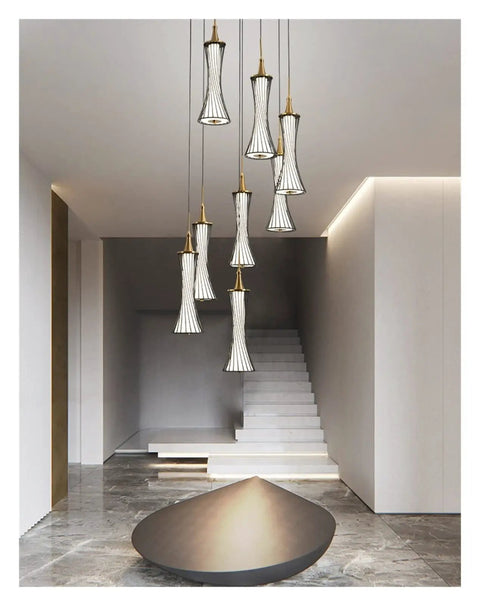 Modern Black Creative Pendant Lamp Pretty Waist LED Light for Duplex Living Room Staircase Loft Restaurant hanging in upscale setting.