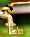 90 Degree Water Hose Elbow For RV And Garden: Brass Three Quarter Inch GHT Connector With Shut Off Valve, Lead-Free Inline Fitting For Tight Spaces, Prevents Kinks And Strain In City Water Hookups. Brass 90-degree hose elbow on garden faucet