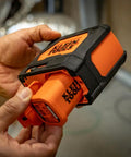 Self Leveling Laser Level With 3x360 Degree Green Beams Rechargeable Battery Magnetic Mount And Compact Rugged Design For Fast Accurate Interior And Exterior Layouts On Any Jobsite, orange unit in hand