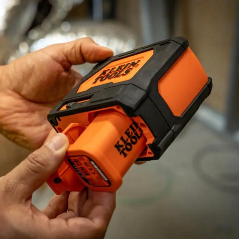 Self Leveling Laser Level With 3x360 Degree Green Beams Rechargeable Battery Magnetic Mount And Compact Rugged Design For Fast Accurate Interior And Exterior Layouts On Any Jobsite, orange unit in hand