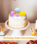 White cake with sun, cloud, and hot air balloon shapes from 2 Pack Silicone Chocolate Molds With 12 Cavities Sun Cloud Rainbow Hot Air Balloon Shapes
