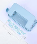Two Hole Paper Punch Metal Blue Desktop Puncher for File Folders and Loose Leaf Books showing standard hole distance measurement.