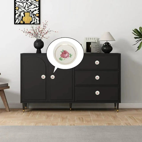 Totally Iconic 6 Piece Set Of Hand Painted Ceramic Knobs With Sweet Pink Rose Designs on a black dresser in a chic home setting.