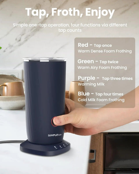 Hand pressing button on dark blue 4 In 1 Milk Frother And Steamer For Latte And Cappuccino At Home, Warm And Cold Foam, Milk Warmer To About 150F, Rich Creamy Froth, Dark Blue Electric Coffee Frother.