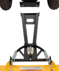 Close-up of a mechanical attachment under an ATV, showing structural design and springs
