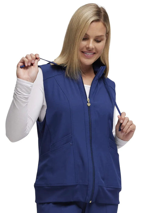 Woman wearing navy Zip Front Scrub Vest With Detachable Hood For Women, Stretch Fabric, Flattering Fit, Princess Seams, Plenty Of Pockets