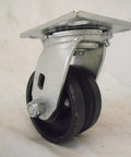 Swivel caster with mounting plate; 4x2 in, 7/8 in V-groove iron steel wheel