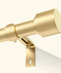 Close-up of gold curtain rod with bracket, part of Gold Curtain Rods For Windows 66 To 120 Inches, 1 Inch Adjustable, Heavy Duty Wall Mount.