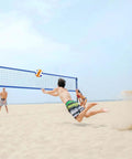People playing beach volleyball with Heavy Duty Outdoor Volleyball Net Set With Anti Sag Design And Adjustable Aluminum Poles