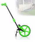 Rock Solid Aluminum Measuring Wheel With Giant Digital Dial And Easy Fold Handle For No Sweat Field Work And Swift Land Surveying Up to 9999 Meters, green color, adjustable handle, ready for outdoor use.