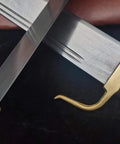 Bart Cham Dao Damascus Steel Hand Made Sword with brown leather sheath and copper handle on black background