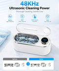 Ultrasonic Jewelry Cleaner Delivers Knockout Deep Clean With 48KHz Waves 440Ml Tank with glasses in stainless steel basin.