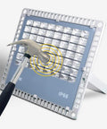 Heavy Duty 200W LED Flood Light With Tough As Nails Waterproof Housing For Yard Billboard And Deck Super Bright Outdoor Spot Lighting No Cap Badass Performance Rock Solid Build Hella Durable being tested with a hammer.
