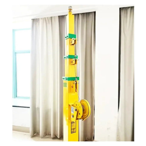 Rock Solid Manual Cable Winch Telescopic Aluminum Mast Eight Meter Reach showing yellow mast and crank mechanism for lifting.