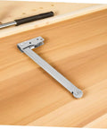Rock Solid Heavy Duty Stainless Steel Automatic Fire Door Closer With Quick Release Sequencer And No Sweat Setup For Top Tier School Safety Along Tight Hallways on a wooden surface.