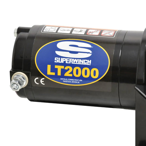 Close-up of 2000 Pound 12 Volt ATV Winch With Low Amp Permanent Magnet Motor casing, featuring product branding and labels.