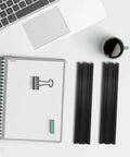 Two Pack Black Aluminum Linear Rail Extrusion Guide With Anodized Finish for heavy duty automation gear on a desk with notebook and coffee