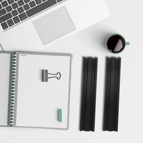 2 Pack Aluminum Extrusion Profiles Black Linear Rail With Anodized Finish beside a notebook on desk