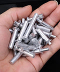 Hardcore Aluminum Hammer Drive Expansion Rivets 10 Pack Heavy Duty Tapping Screw Fasteners With Countersunk Nail Heads Dead Nuts 6.4X30Mm held in hand.