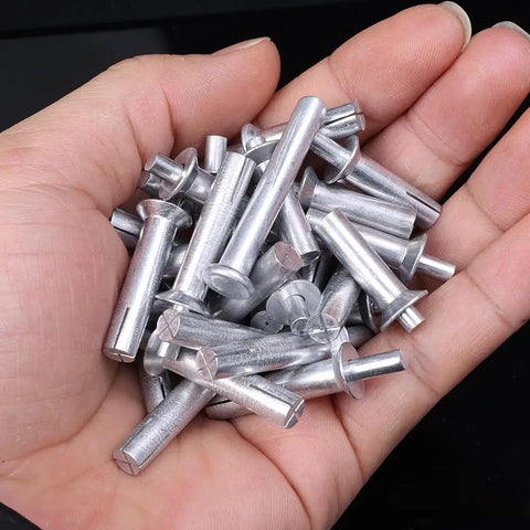 Hardcore Aluminum Hammer Drive Expansion Rivets 10 Pack Heavy Duty Tapping Screw Fasteners With Countersunk Nail Heads Dead Nuts 6.4X30Mm held in hand.