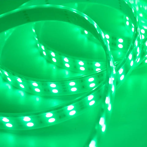 Close-up of Five 5M RGB LED Strips Kit With IP67 Waterproof Silicone Sleeve, emitting green light, SMD5050 Double Row 120 LEDs Per Meter.