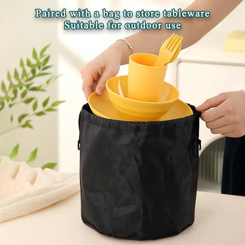 Camping Mess Kit For Four With Plates Bowls Cups Utensils And Carry Bag Food Grade Plastic Outdoor Dinnerware Gear For Travel Picnics And Campouts On The Go displayed with yellow dinnerware in a black bag