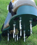 Shoe with 20 Pack 3 Inch Soil Aerator Replacement Spikes For Lawn Shoes Durable Aerator Tines attached, on grass.