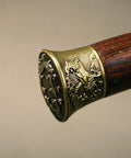 Close-up of the rosewood handle with phoenix motif on the Folded Steel Dao Sword With Phoenix Motif, Handmade High Carbon Blade With 32,768 Layered Steel