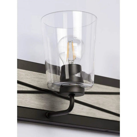 Close-up of Three-Light Coastal Bath Vanity Light With Clear Glass, Rustic X-Brace Design, Faux Woodgrain Backplate