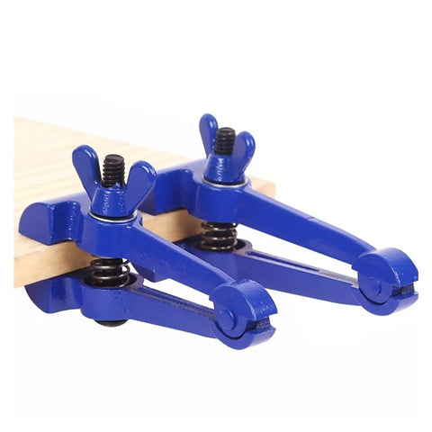 Durable Handheld Vise Clamp For Welding Jobs With Textured Jaws To Grip Metal Tight And Stop Slipping During Grinding Filing Or Cutting Tasks For Serious DIY Pros on a wooden surface.