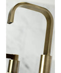 Antique Brass Widespread Bathroom Faucet With Drip Free Ceramic Disc Cartridge Deck Mount Eight To Sixteen Inch Three Hole Installation One Point Two GPM Flow At Sixty Psi One Half Inch IPS Connection Classic Modern Blend shown close-up