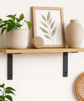 Heavy Duty Shelf Brackets Built Tough Quarter Inch Thick Steel Matte Black Iron Finish For Modern Farmhouse Rustic Open Shelving With Hardware Four Pack L Shaped 8 By 6 Inches supporting wooden shelf with decor