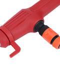 Close-up of the red nozzle attachment of a portable cordless stick water transfer pump for backyard flooding.
