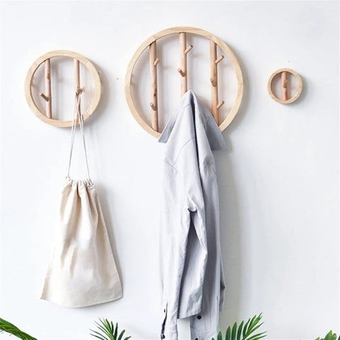 Solid Wood Wall Mount Coat Hooks For Everyday Gear Heavy Duty Nordic Style Round Cloak Pegs. Three wall hooks displaying a jacket and bag.